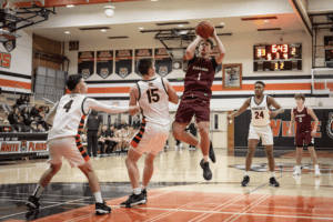 Joe Crupi shoots in traffic against Mamaroneck on Dec. 13. The Huskies fell to the Tigers at the Harry Jefferson Showcase.